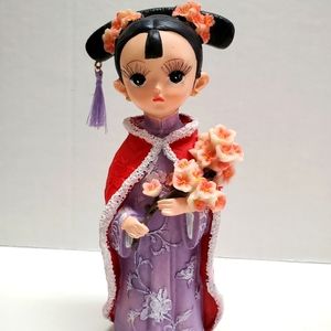 Asian flower girl doll.
